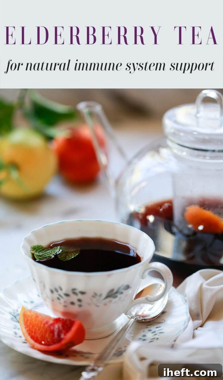 A cup of elderberry tea next to a teapot. Text overlay reads "elderberry tea for natural immune system support." 