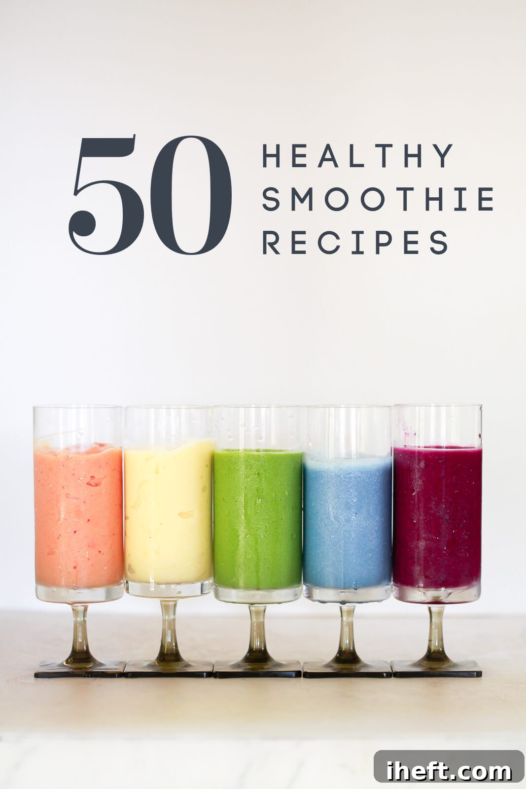 5 colorful healthy smoothies on a white kitchen counter. Text overlay reads "50 healthy smoothie recipes"