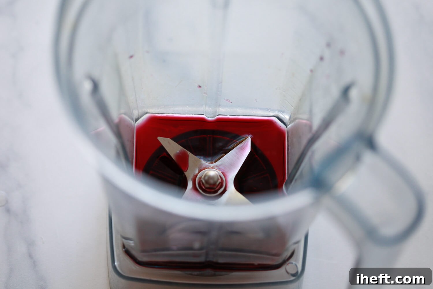 Pomegranate juice in the bottom of a Vitamix blender.
