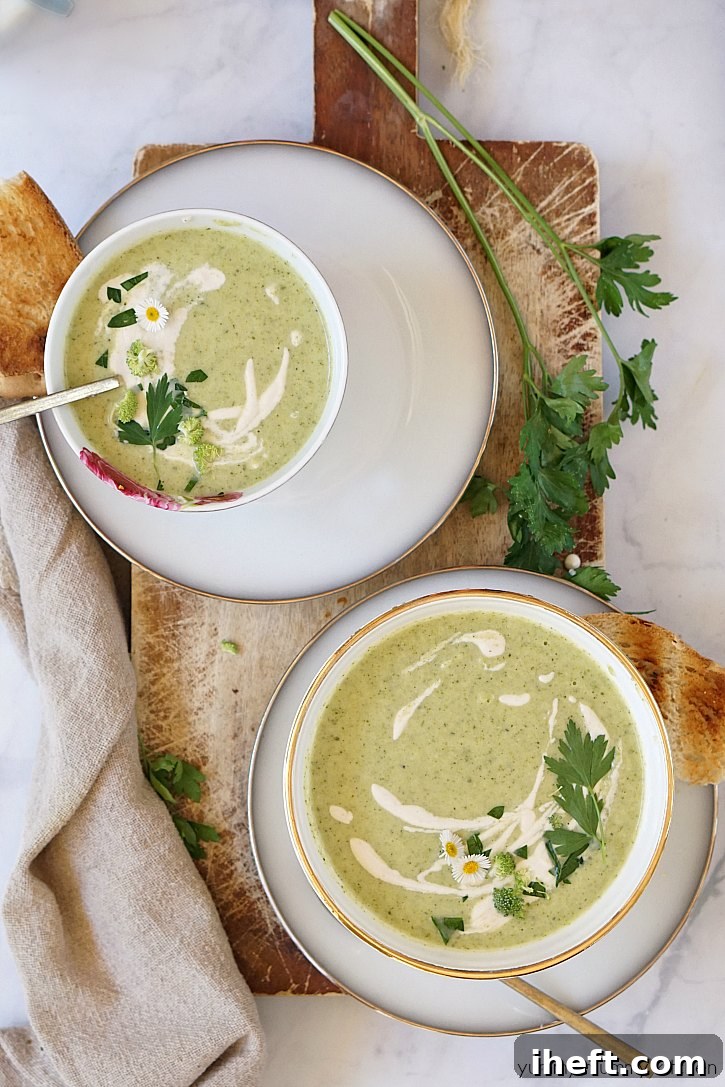 Beautiful bowls of creamy vegan broccoli soup topped with cashew cream. 