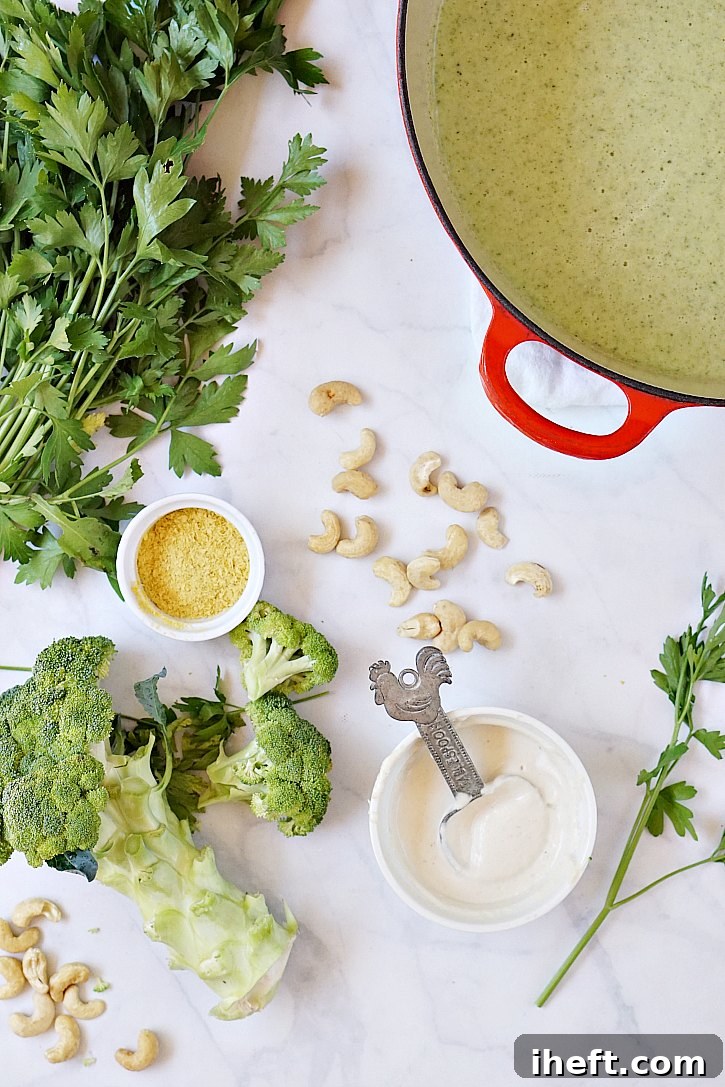 The simple ingredients for this vegan cream of broccoli soup include cashews, nutritional yeast, parsley, garlic, and broccoli. 