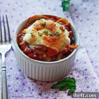 Easy spaghetti pie recipe baked in a ramekin and topped with ricotta and mozzarella cheeses.