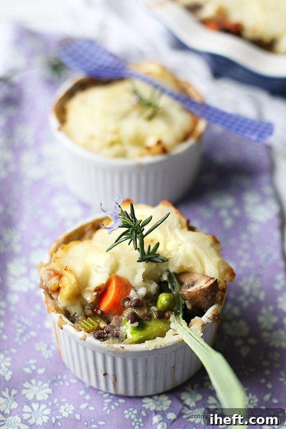 Individual ramekins filled with hearty vegan lentil shepherd's pie, beautifully topped with fluffy mashed potatoes, making for a wholesome and comforting healthy vegan meal idea.