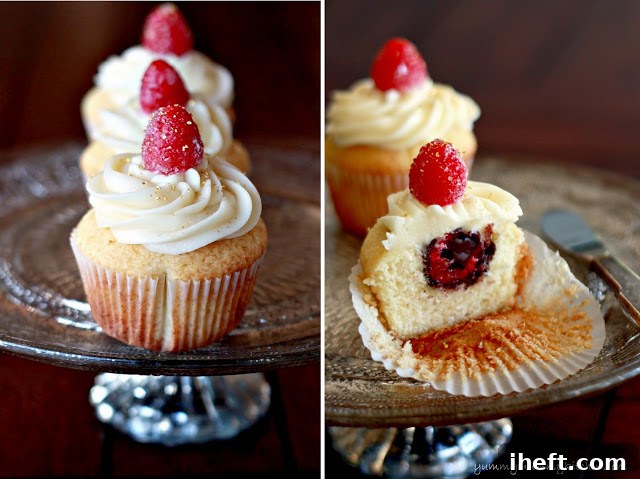 Exquisite chocolate raspberry surprise cupcakes with a single raspberry and gold leaf garnish, ready to be enjoyed.