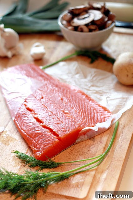 Close-up of fresh, raw wild salmon fillets, ready for cooking.
