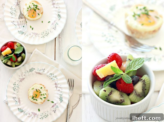 A close-up view of golden-brown filo baked egg cups filled with spinach and cheese, presented alongside a bowl of colorful fresh fruit, making a wholesome and inviting meal.
