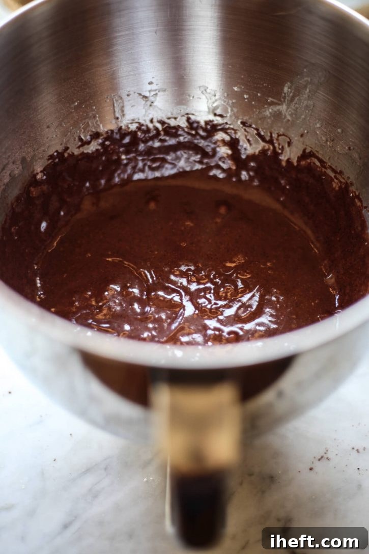 Vegan chocolate cupcake batter in the bowl of a mixer. 