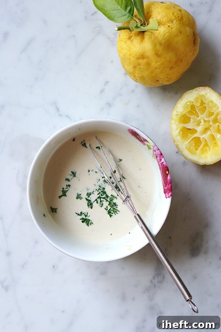 This easy tahini sauce recipe adds delicious flavor and creaminess to falafel, wraps, salads, and vegetables. 