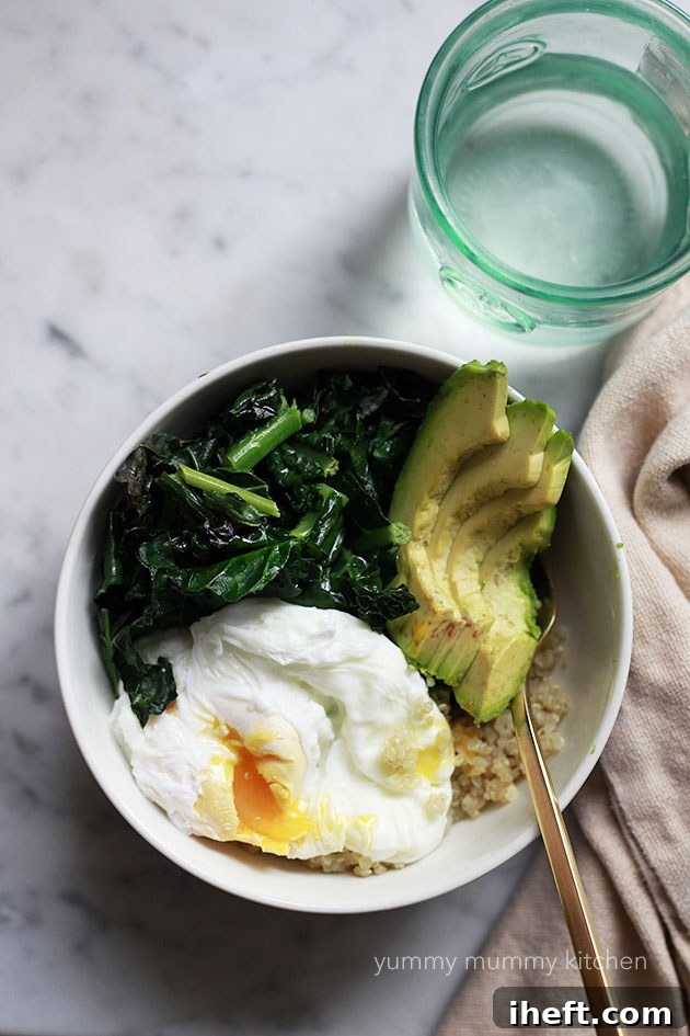 A nourishing bowl of quinoa, vibrant kale, creamy avocado, and a perfectly poached egg, representing a vegetarian meal.