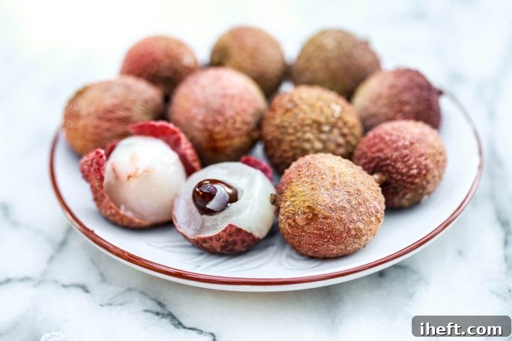 A dish filled with lychee fruits. 