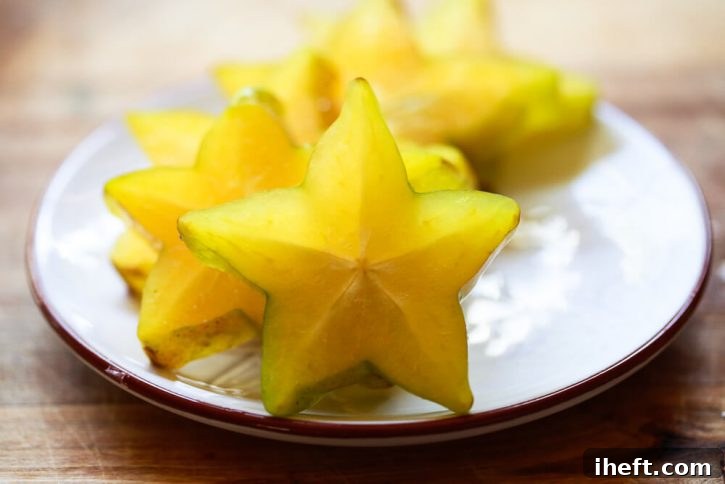 A dish filled with sliced star fruit. 