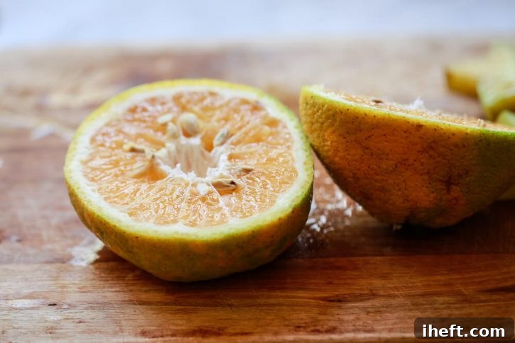 A close up photo of Ugli, or Jamaican Tangelo, cut in half. 