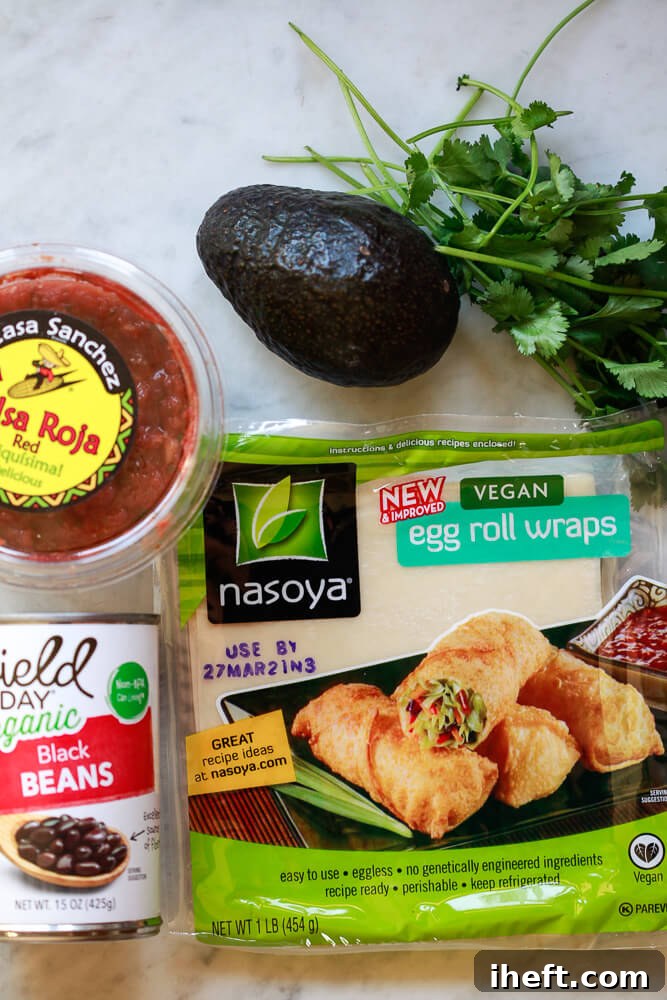 The ingredients for avocado egg rolls on a white kitchen counter. 