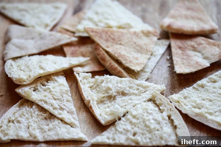 Pita bread triangles are ready to be baked or air fried to make homemade pita chips.
