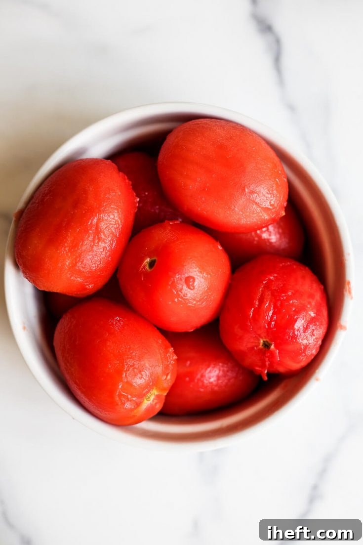 Peeled tomatoes in a bowl ready for cooking