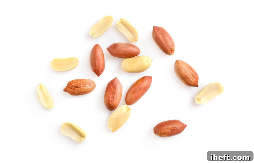 A close up photo of shelled peanuts, showcasing their unique texture.