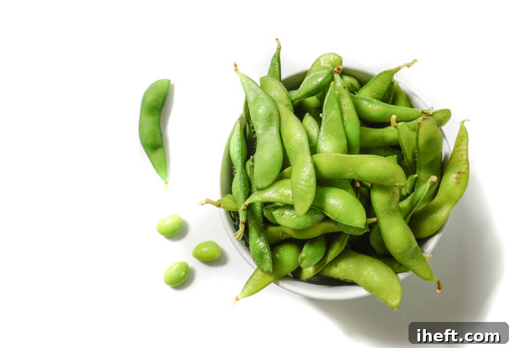 A bowl of edamame soy beans, vibrant green and ready to eat.