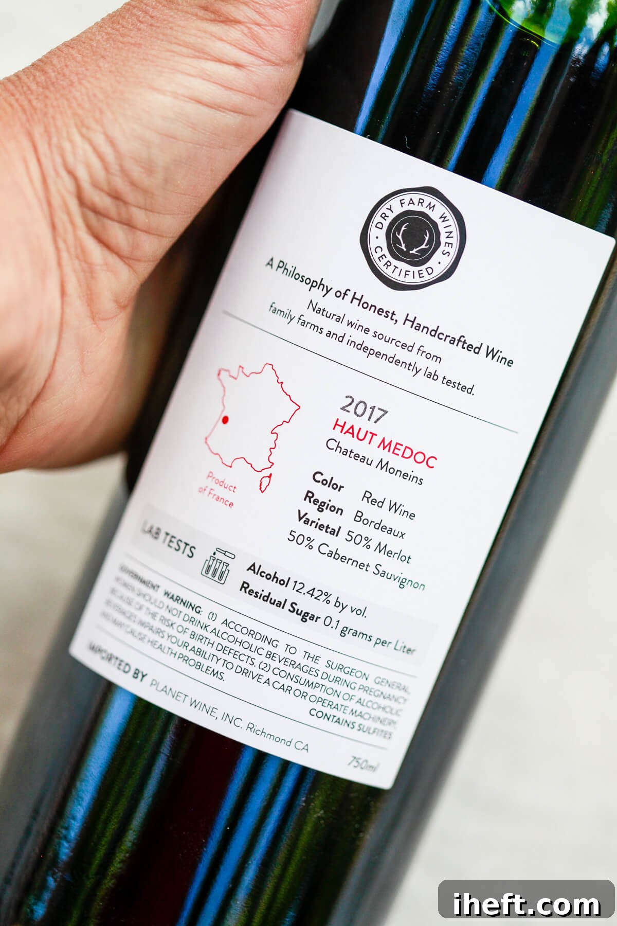 The back label of a Dry Farm Wines bottle of exquisite red wine. The label prominently displays its vintage, 2017, and origin, Medoc, France, alongside crucial details like alcohol percentage and residual sugar content, emphasizing transparency.