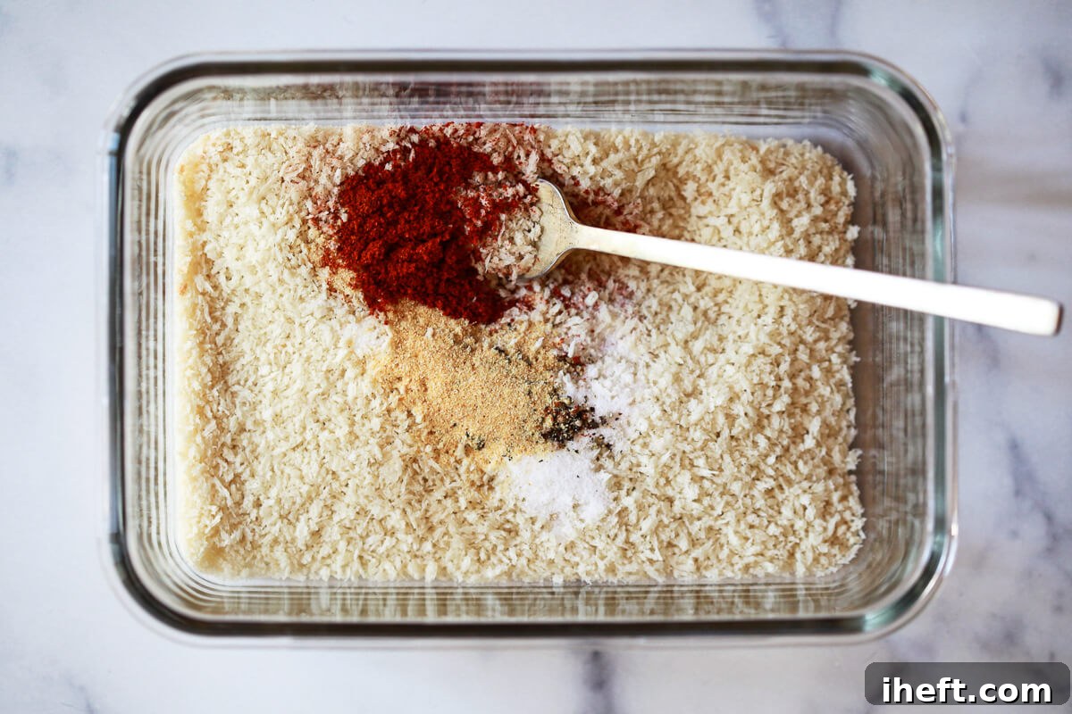 Breadcrumbs and spices are stirred together in a shallow dish, creating a flavorful coating for the fried oyster mushrooms.