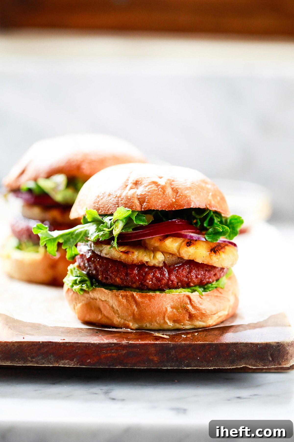 A large, juicy vegetarian Pineapple Teriyaki Burger, grilled to perfection, making an excellent Blackstone griddle recipe.