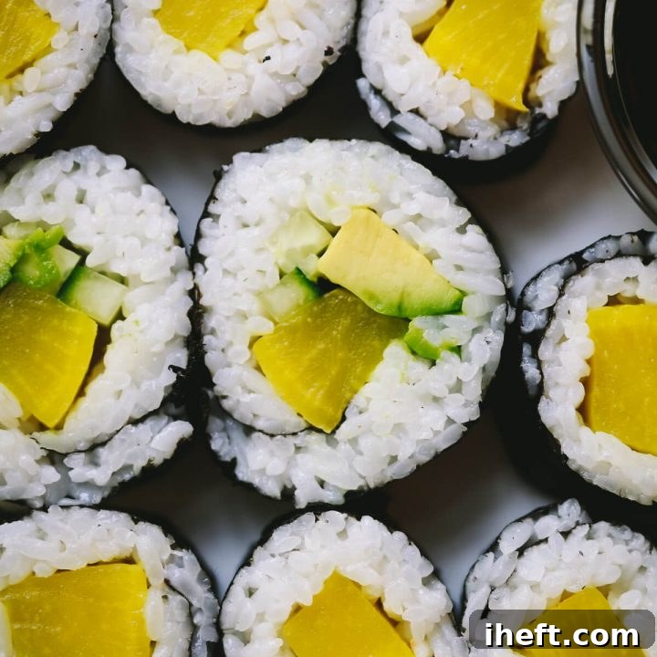 A close-up photo of freshly prepared oshinko sushi rolls, showcasing their vibrant colors and appealing texture.