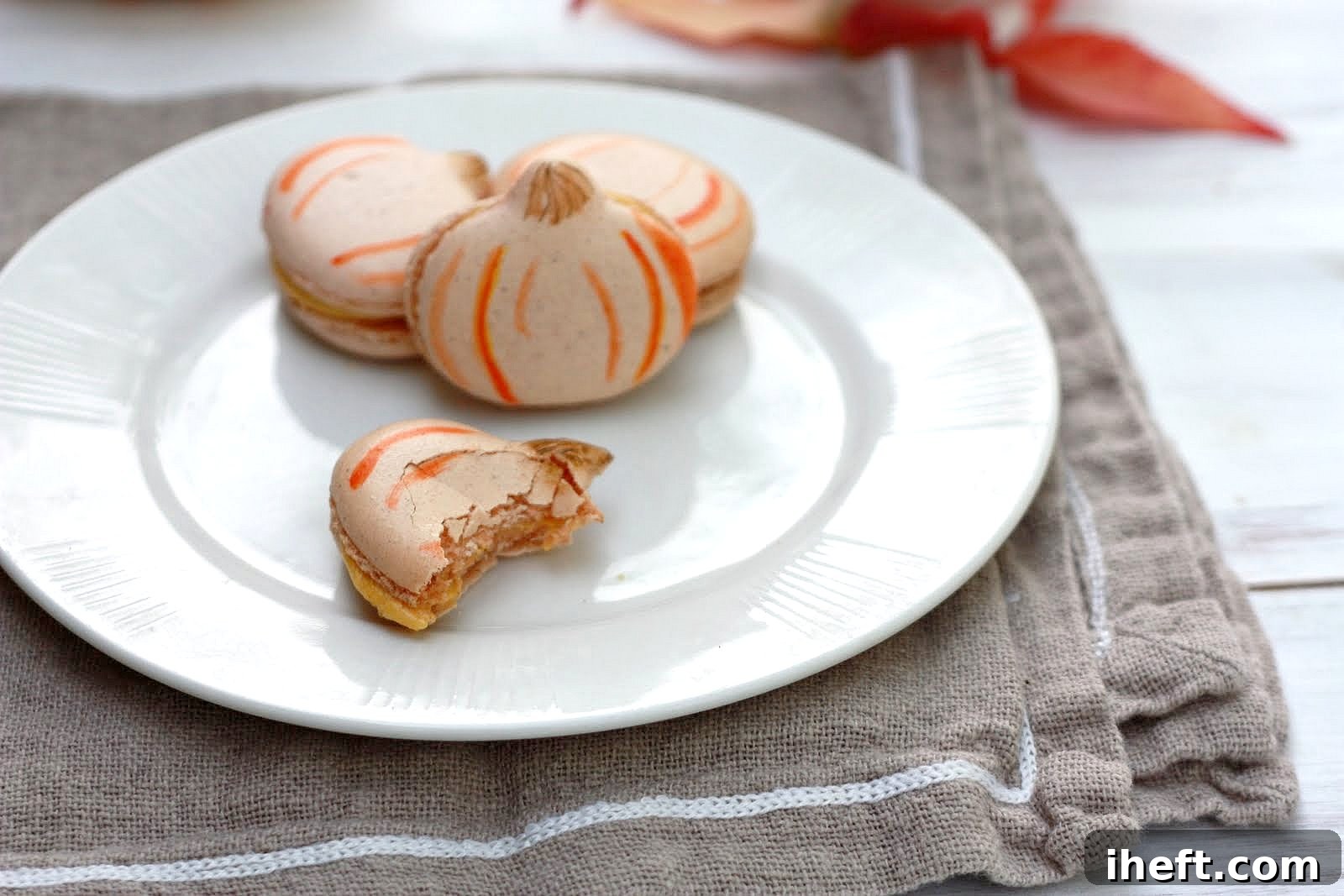 Pumpkin French Macarons arranged beautifully on a plate, ready to be served.