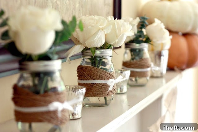Fall centerpiece with Mason jars wrapped in twine and ribbon