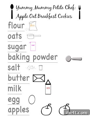 A child's hand holding a fresh apple oat breakfast cookie, ready to take a bite.