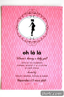Smiling mommy-to-be posing elegantly at her Parisian-themed baby shower