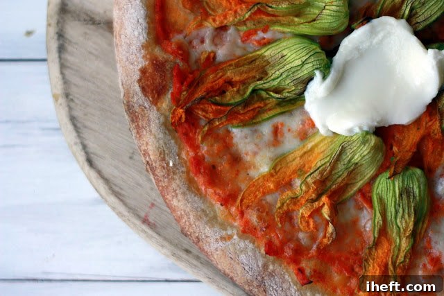 A decorative image for Pinterest sharing, showcasing the beautiful Squash Blossom Pizza for seasonal recipe ideas.