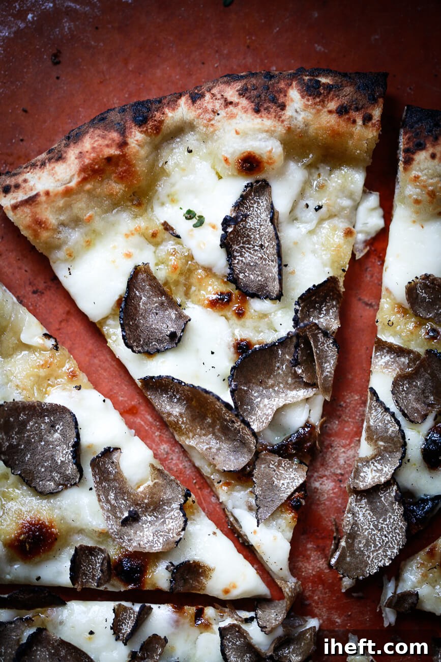 A pizza recipe made with mozzarella and freshly shaved black truffles. 