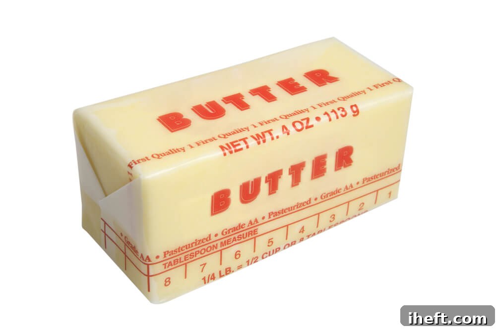 A stick of butter with clear tablespoon markings on the wrapper, simplifying butter measurements.