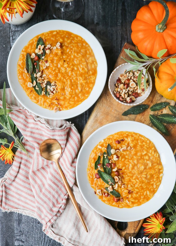An overhead photo of two bowls of pumpkin risotto topped with hazelnuts. 