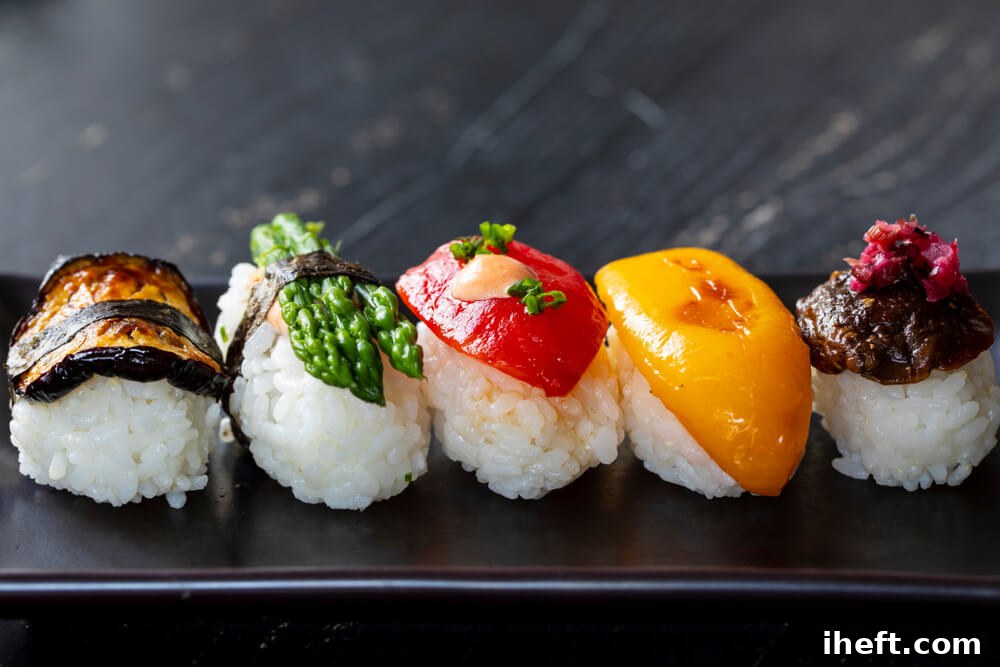 Vegetable nigiri rice topped with eggplant, asparagus, and peppers.