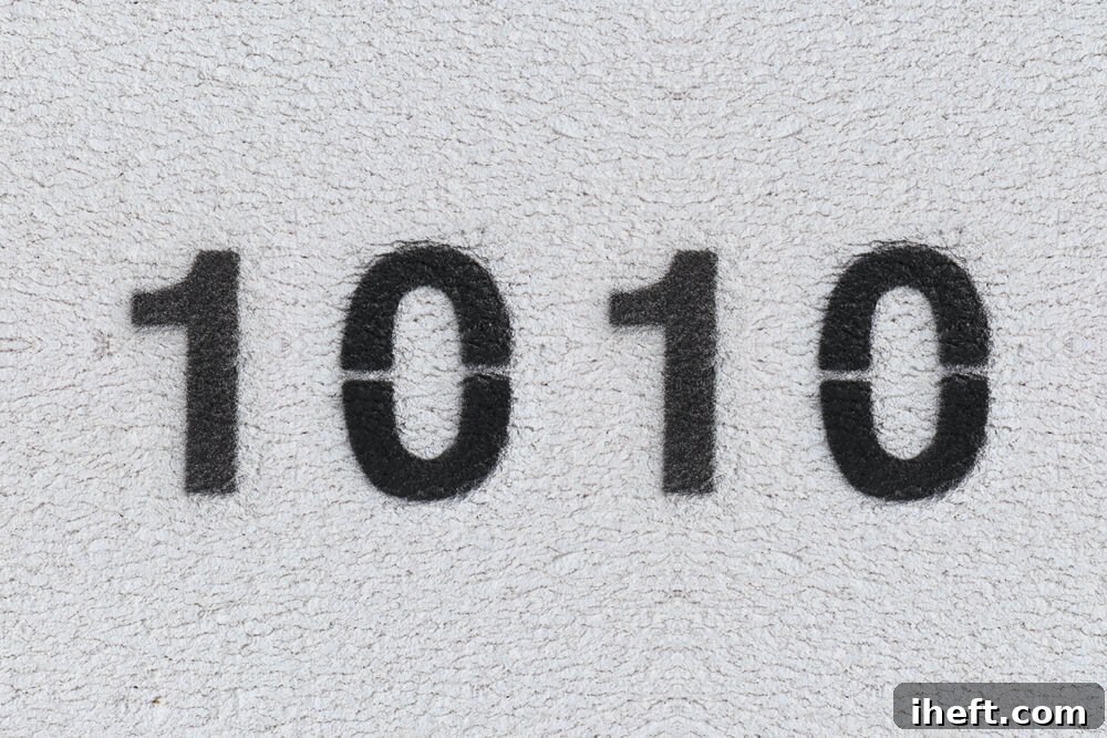 The number 1010 in black on a white wall, representing a clear divine message