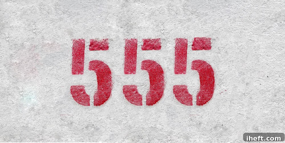 Grey concrete with the number 555 in red.