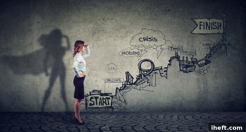 A woman stands looking up an illustrated career path. Her shadow wears a cape.
