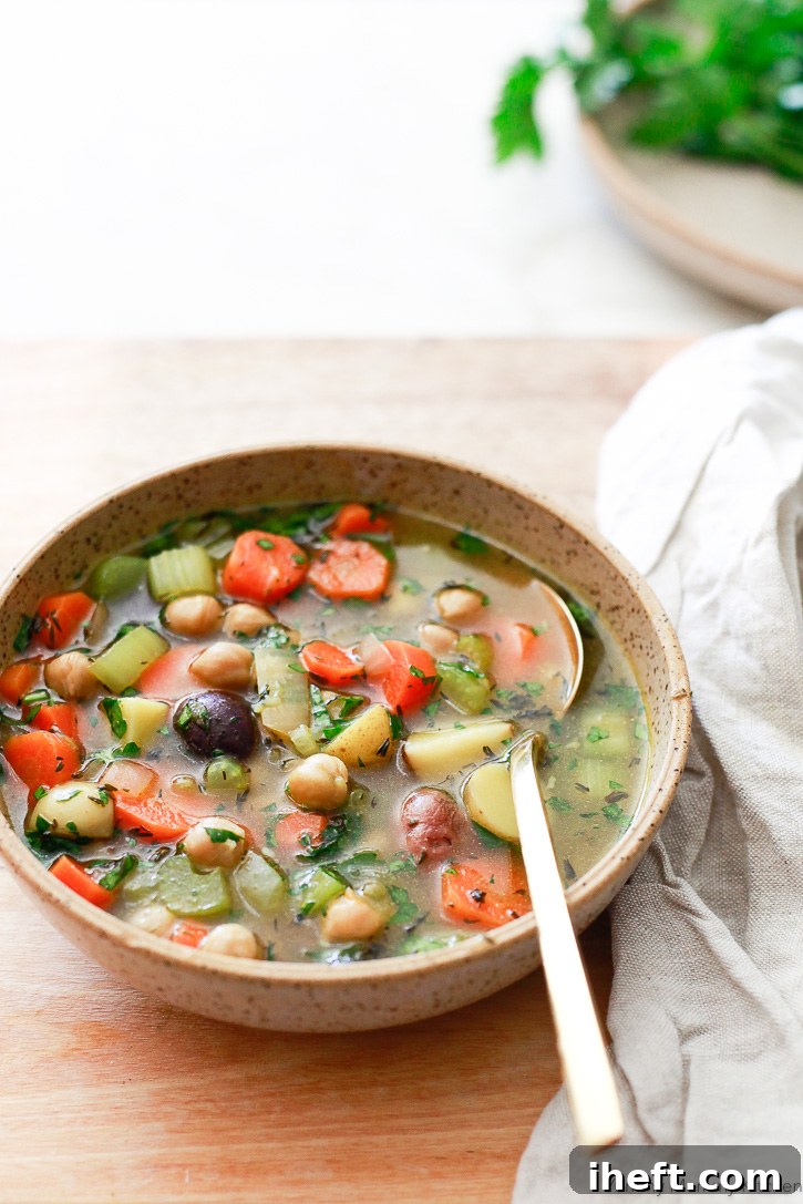 An easy vegetarian 'chicken soup' recipe, prepared with fresh vegetables and nutrient-dense chickpeas. Ideal for a healthy, plant-based meal.