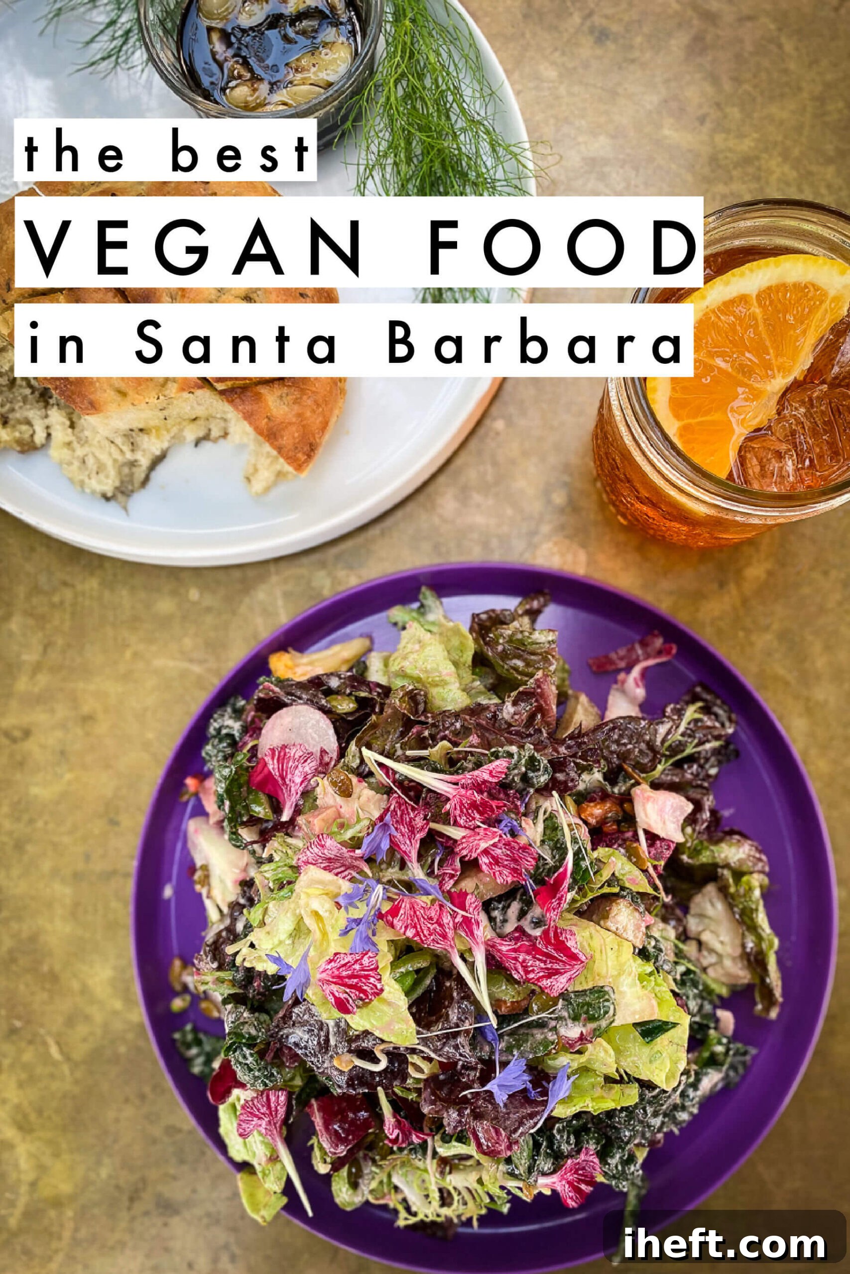 An overhead photo of a beautifully plated vegan salad garnished with vibrant edible flowers on a purple dish, accompanied by crusty bread and a refreshing aperol spritz. The image text overlay reads 'The Best Vegan Food in Santa Barbara'.