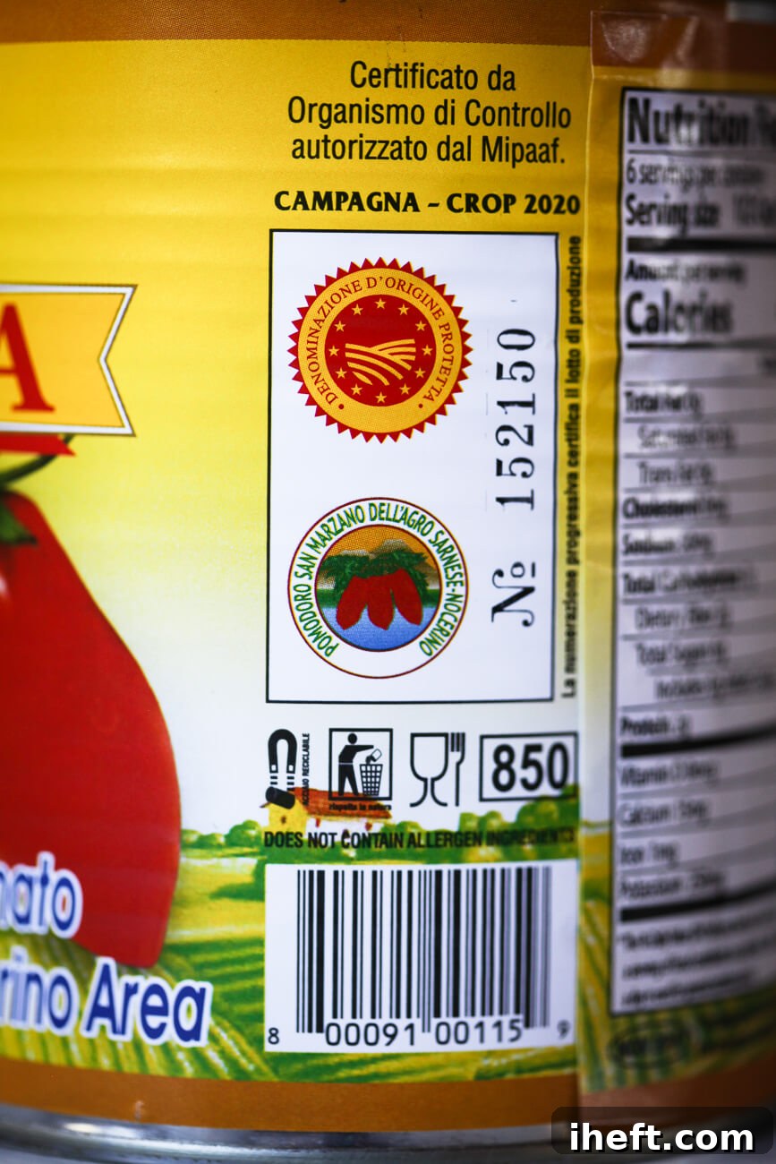 A close-up of the labels on a can of San Marzano tomatoes showing the DOP labels.