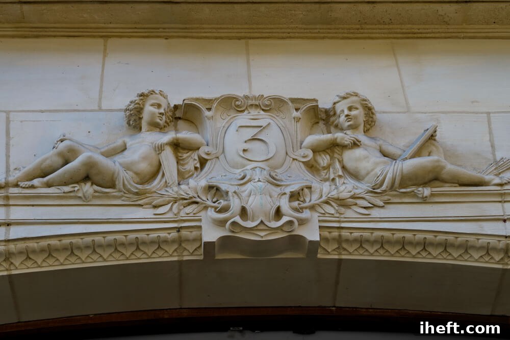 An architectural arch with two angels resting against a carved number 3, representing divine protection and spiritual foundation.