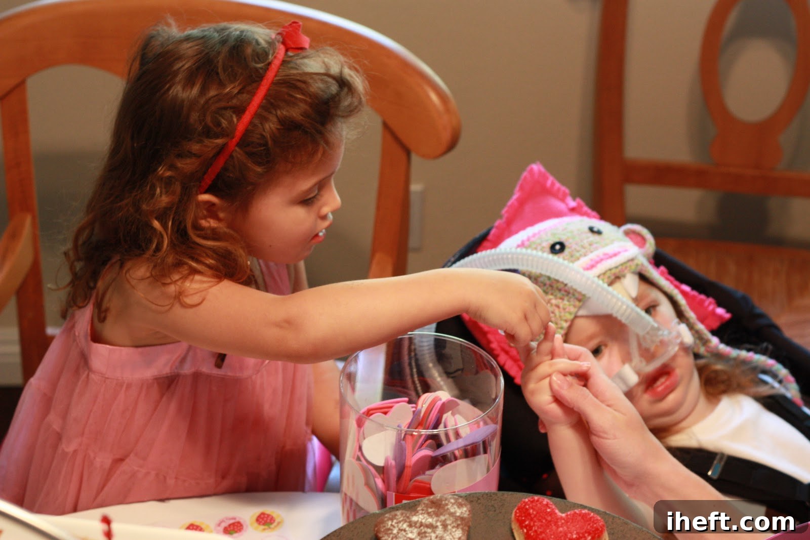 A tender and sweet moment captured between two young children during the playdate, highlighting their strong friendship.