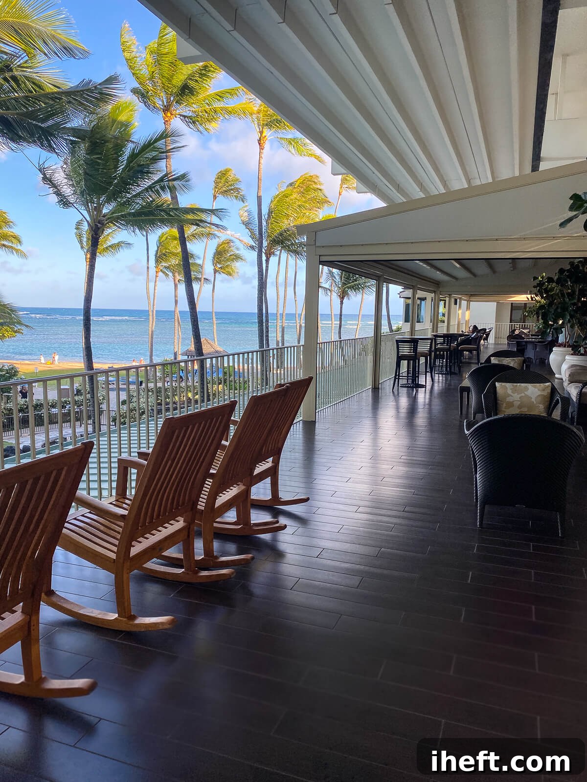 Wooden rocking chairs on the Veranda overlooking the ocean at the Kahala. 