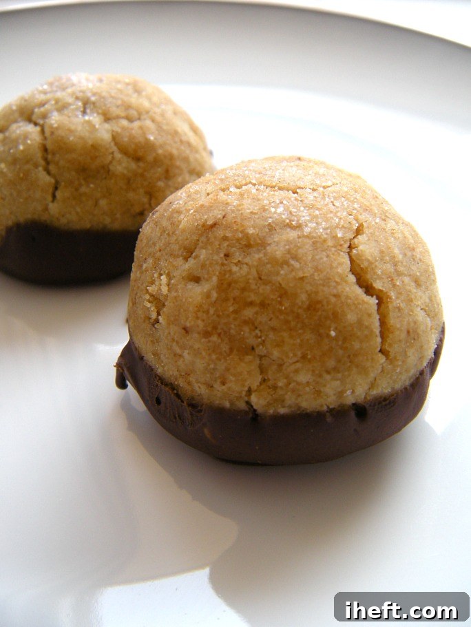 Close-up of freshly baked brown butter sea salt cookies, showcasing their golden edges and sea salt flakes.
