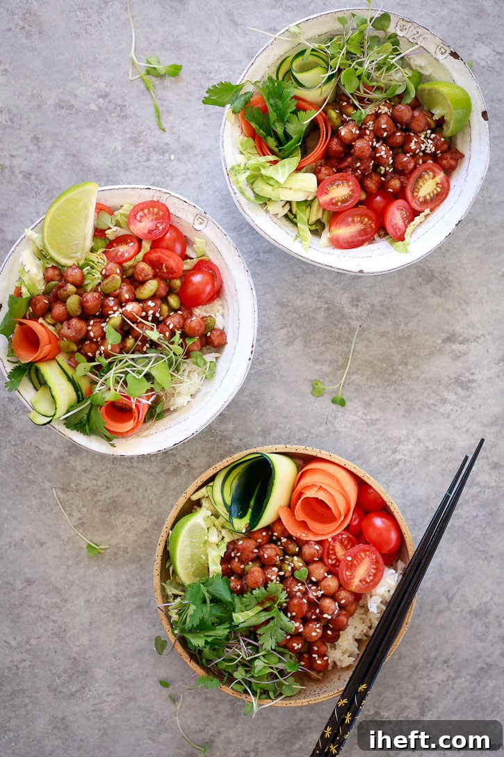Korean BBQ Chickpea Bento Bowls, beautifully arranged with roasted chickpeas, colorful vegetables, and rice.