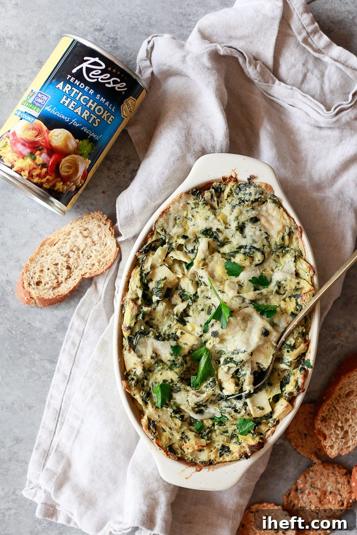 A warm and delicious vegan baked spinach artichoke dip made with Reese foods artichoke hearts and heats of palm. 