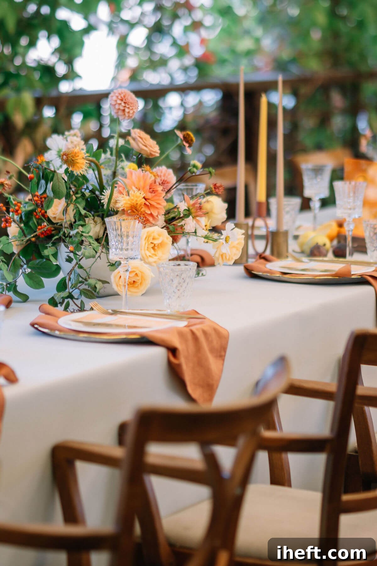 A sophisticated formal autumn table setting, featuring a harmonious color scheme of warm apricot, rich rust, and verdant green, creating an elegant and inviting atmosphere.