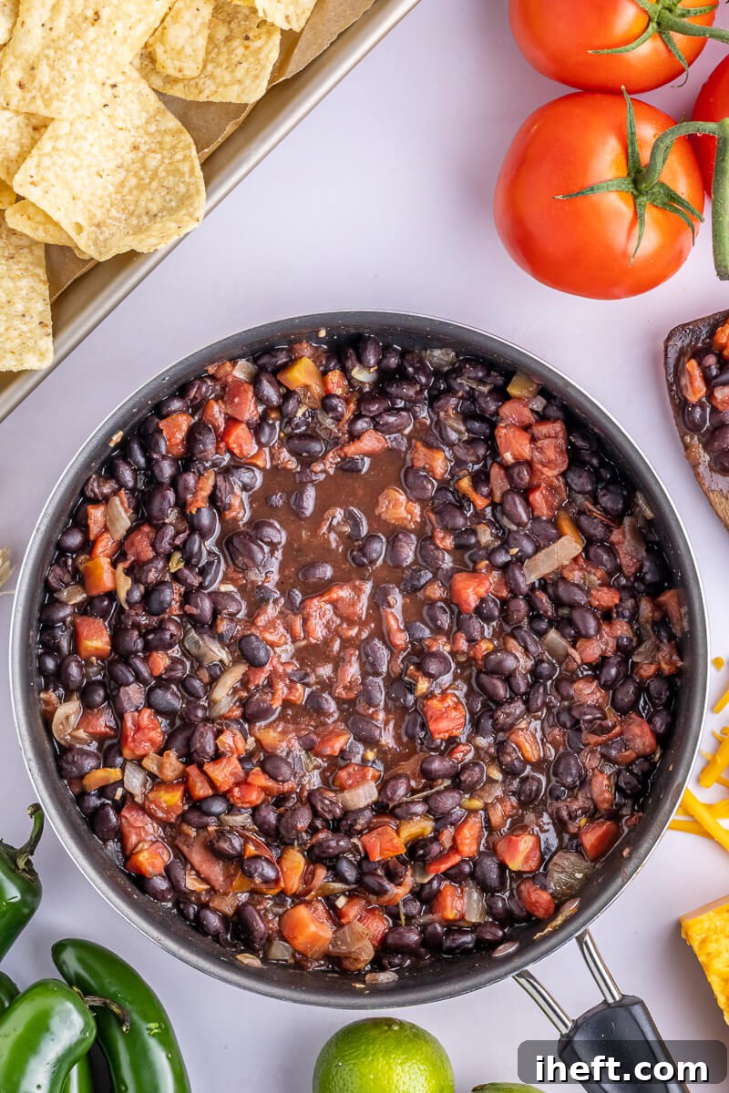 A skillet of seasoned black beans.