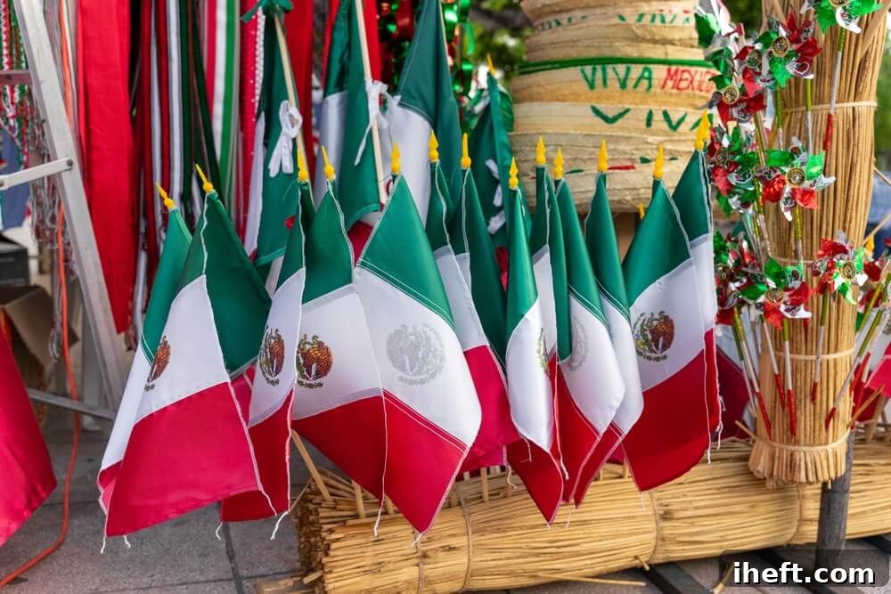 Small Mexican flags for sale in Mexico. The colors of the Mexican flag are green, white, and red. 