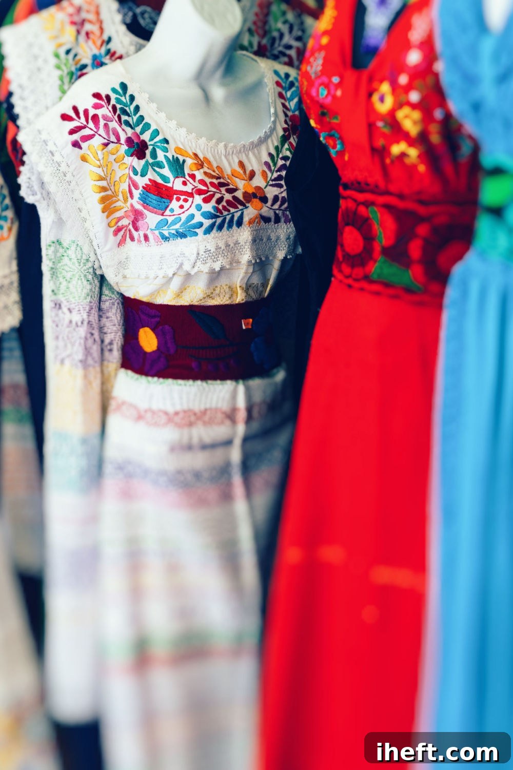 White, red, and blue Mexican embroidered dresses for sale. These beautiful dresses are a good example of Mexican colors for Cinco de Mayo or Fiesta. 
